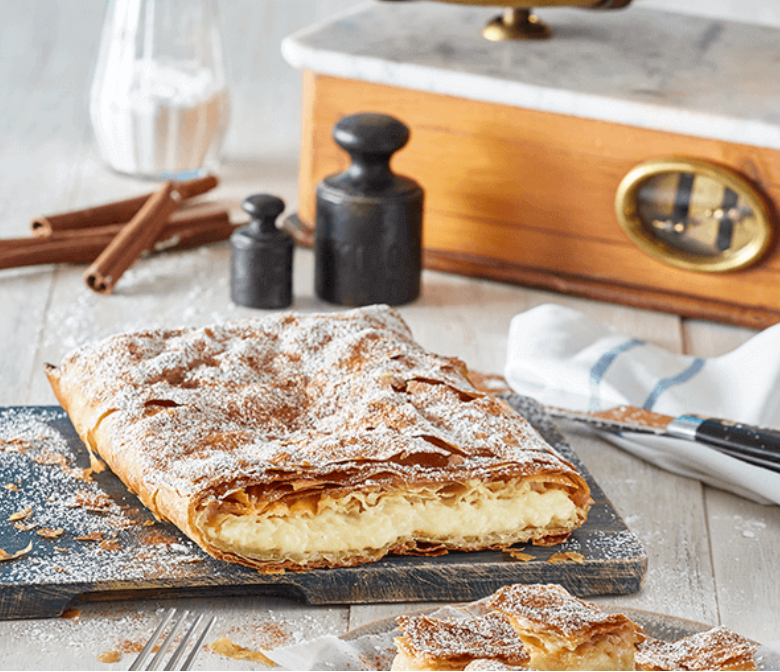 Greek bougatsa with custard cream traditional Thessaloniki pastry serving suggestion
